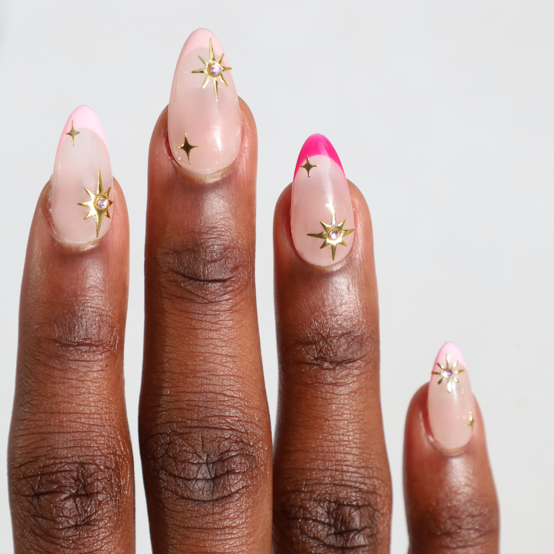 Dark skinned hand with Celestial Winter Pink French Tips